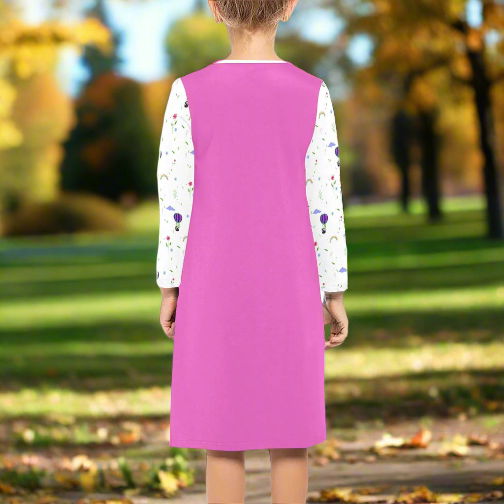 Back view of a girl's long sleeve fall dress in pink with colorful sleeve designs, perfect for stylish autumn outings.